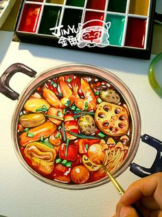 a person is painting a pizza on a white surface with watercolors and brushes