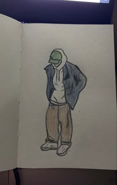 an open book with a drawing of a man wearing a hat and jacket on it