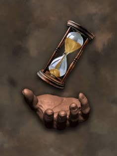 a hand holding an hourglass with gold and white sand in it on a brown background