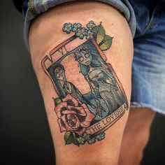 a woman's leg with a tattoo on it