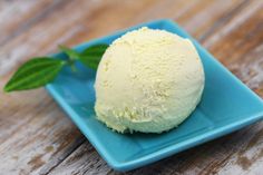 a blue plate topped with a scoop of ice cream