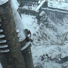 an aerial view of a castle in the snow