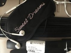 a piece of luggage with headphones attached to it and the words sweet dreams written on it