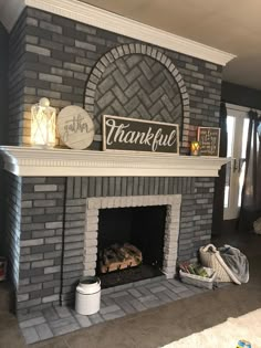 a brick fireplace with a sign that says, thank you for thanksgiving on the mantle