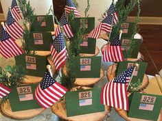 the table is decorated with american flags and place cards