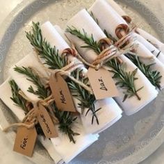 napkins wrapped in twine and tied with twine are sitting on a plate