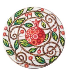 a round box with an artistic design on the front and sides, decorated with leaves and berries