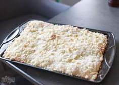 a pan filled with food sitting on top of a table