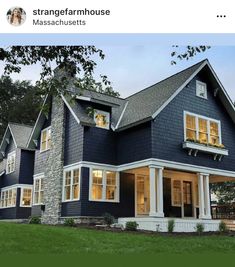 a blue house with white trim and windows on the front porch is featured in this postcard