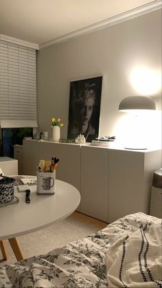 a living room filled with furniture and a white table topped with a vase full of flowers