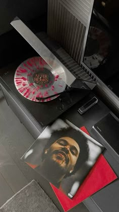 a record player with a red and white disc