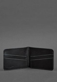 Introducing our High-Quality Compact Men's Leather Wallet, a perfect blend of elegance and functionality. Crafted from premium genuine leather, this slim wallet is designed for the modern gentleman who values both style and convenience. It features multiple card slots and a spacious compartment for bills, all while maintaining a sleek and minimalist profile. The refined leather finish adds a touch of sophistication, making it a timeless accessory for any occasion. Durable and lightweight, this w Formal Black Soft Leather Wallets, Black Soft Leather Rectangular Wallet, Luxury Leather-lined Wallets For Daily Use, Black Leather Wallet For On-the-go, Luxury Leather Wallet On Chain, Rectangular, Elegant Man, Slim Wallet, Modern Gentleman, Leather Wallet Mens