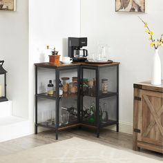 a kitchen area with a microwave, coffee maker and other items