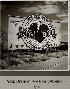 an advertisement for the country music festival, featuring a heart and stars on a large sign