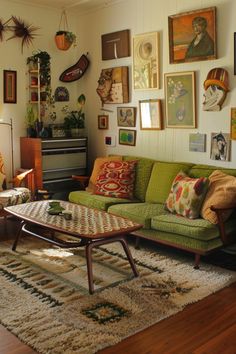 a living room filled with furniture and lots of pictures on the wall above it's coffee table