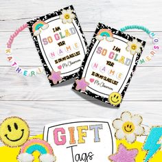 two gift tags with embellishments on them