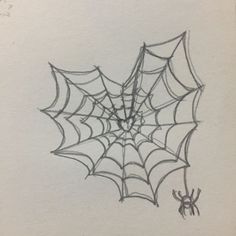 a drawing of a spider web on paper