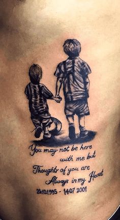 the back of a woman's stomach with an image of two children holding hands