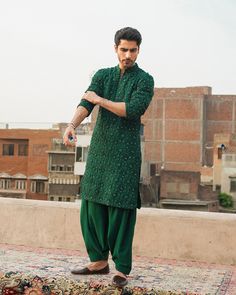 Elevate your style with our Karandi Castleton Green Kurta and Shalwar ensemble. Whether it's for Eid, weddings, or any special occasion, our embroidered and bespoke shalwar kameez collection offers luxury and elegance for men, including Pakistani bridal shalwar kameez options.Exuding vibrancy and charm, the castleton green karandi kurta is a statement piece that effortlessly captures attention with its captivating design. Intricate details of cut-pipes, sequins, and kora adornments beautifully e Eid Outfits For Teens, Eid Celebration, Pakistani Kurta, Mehendi Outfit