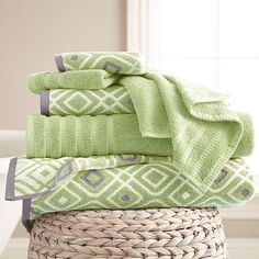 towels stacked on top of each other in a basket