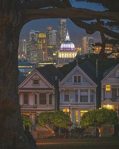 the city skyline is lit up at night in san francisco, californed by tall buildings