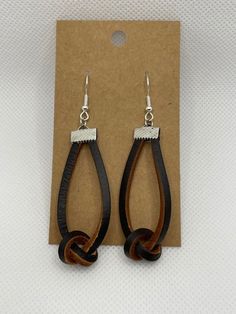 the earrings are made out of wood and metal