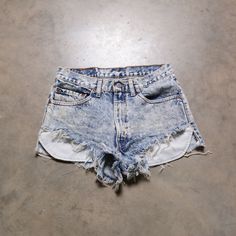 "You are looking at a great pair of vintage 80s Levi's 517 acidwashed cutoffs. Excellent vintage condition. Please see actual measurements below. Waist: 32\" Rise: 12\" Inseam: 2\" Outseam: 11\" If you would like to see additional photos or have any other questions, please do not hesitate to ask, and thanks for looking! Shipping disclaimer: All domestic orders under 16oz ship USPS Ground Advantage. All domestic orders over 16oz ship USPS priority mail. All international orders under 4lbs ship vi Acid Wash Retro Bottoms For Summer, Acid Wash Retro Summer Bottoms, Vintage Acid Wash Ripped Bottoms, Vintage Washed Faded Jean Shorts, Vintage Faded Washed Jean Shorts, Faded Vintage Washed Jean Shorts, Vintage Bleached Faded Bottoms, Vintage Ripped Shorts, Faded High Waist Washed Shorts