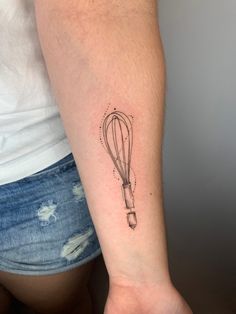 a woman's arm with a tattoo on it that has a hot air balloon