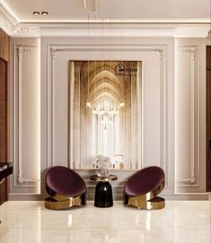 two purple chairs sitting in front of a large mirror on the wall next to a table