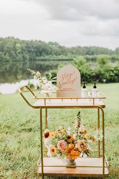 a table with flowers on it in the grass