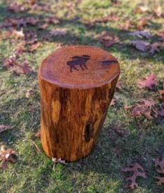 a tree stump with a bear carved on it