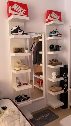 there are two shelves with shoes on them in the room and one shelf is empty