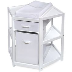 a white wooden night stand with two baskets on the bottom and one drawer open to reveal a bed sheet