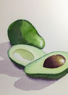 an avocado cut in half on top of a white surface with watercolors