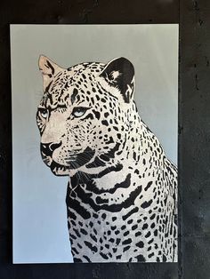 a black and white painting of a leopard