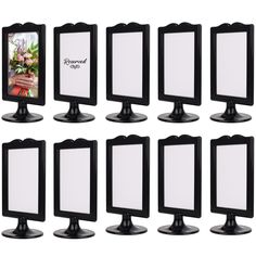 six different sized mirrors with black bases and white frames, each displaying a flower arrangement