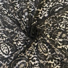 black and white lace fabric with an intricate design