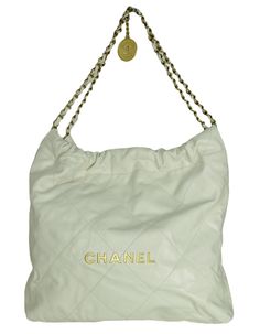 Chanel White Leather Chanel 22 Tote Bag. Features gold hardware spelling out CHANEL Made In: Italy Color: White Hardware: Goldtone Materials: Leather, metal Lining: Beige textile Closure/Opening: Open top Exterior Pockets: None Interior Pockets: Removable zip top pouch Exterior Condition: Excellent pre-owned condition with the exception of light wear to corners and small spot at back- see photo Interior Condition: Excellent pre-owned condition Includes: Chanel dustbag Measurements: 13.5"L x 13.5 Chanel 22, Chanel Tote Bag, White Hardware, Chanel White, Open Top, White Bag, Zip Top, Small Bag, Fashion Handbags