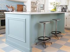 two stools sit in front of the kitchen island