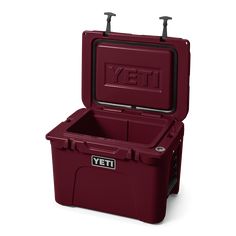 a red yeti cooler with the lid open and two handles on it's side