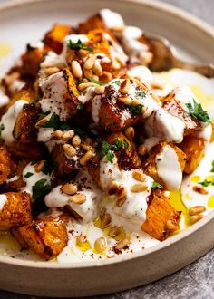 a white plate topped with food on top of a table