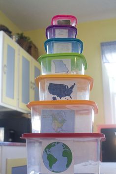 a stack of plastic containers sitting on top of a counter