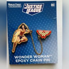 the wonder woman epoxy chain pin is in its box and it says justice league