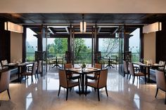 an empty restaurant with tables and chairs