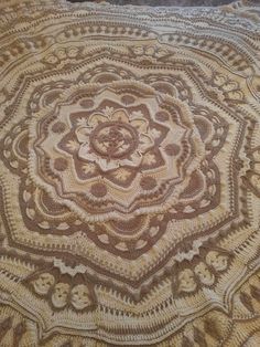 a crocheted doily is laying on the floor