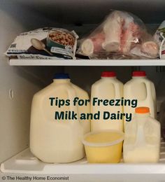 an open refrigerator filled with milk and dairy