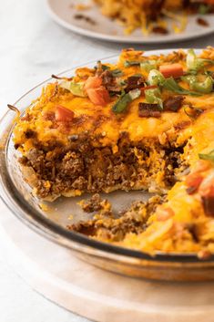 a close up of a plate of food with a slice taken out of the pie