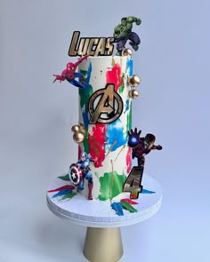 the avengers birthday cake is decorated with superheros