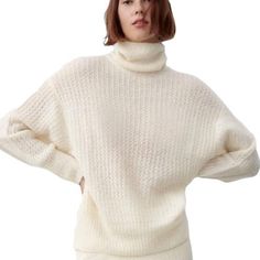 Pointelle Knit Oversized Limited Edition White Sweater White Turtleneck Knit Top For Layering, Oversized White Soft Knit Sweater, Oversized Off White Tops For Winter, Chic White Turtleneck Sweater, White Knit Turtleneck Top, White Turtleneck Knit Top For Spring, Oversized White Chunky Knit Sweater, Chic Oversized Pointelle Knit Sweater, White Knit Turtleneck Sweater