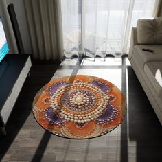 a living room with a couch, television and large glass table in front of the window